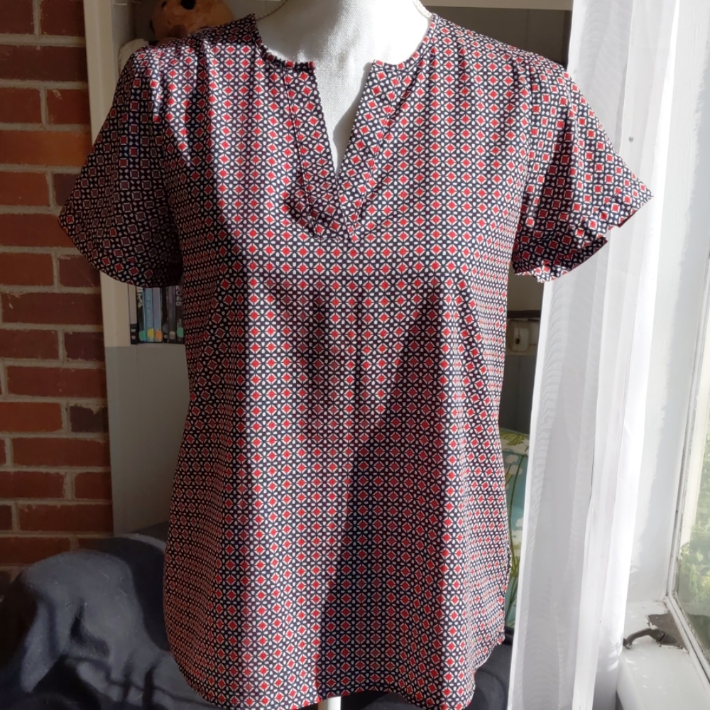 Red and blue geometric pattern blouse